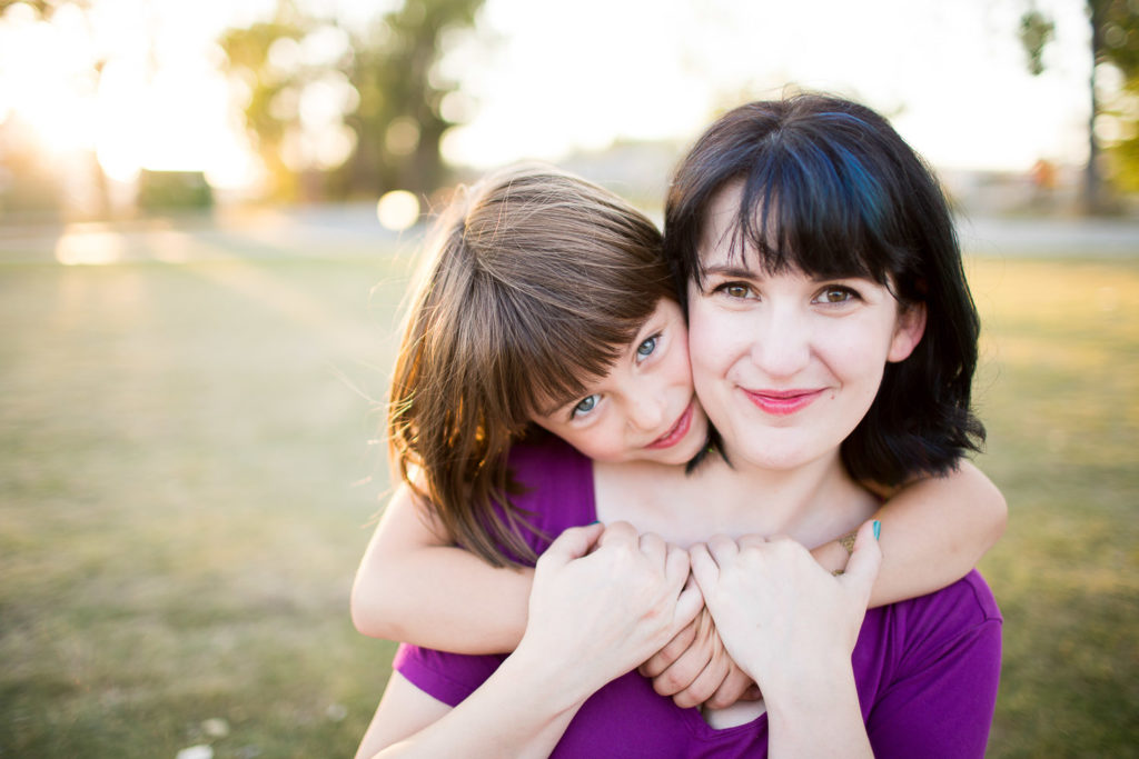 Mom hugging daughter
