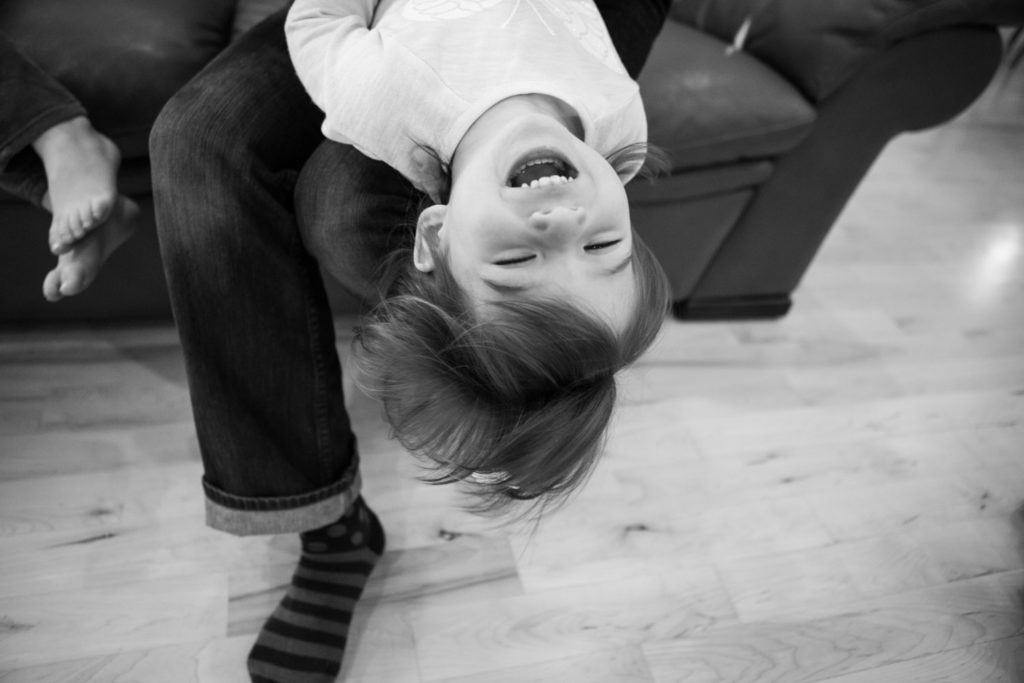 photo of laughing girl black and white