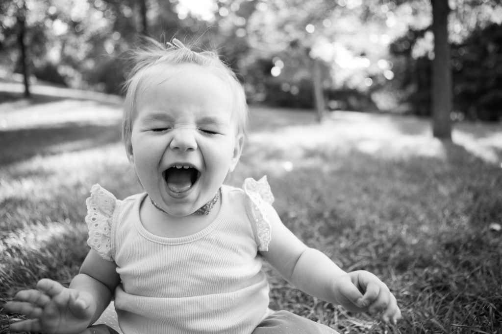 Little girl laughing black and white Calgary photographers Christina (plus) Nathan